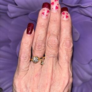 Elegant Round Moissanite diamond with a dangling moissanite heart. GRA Cert